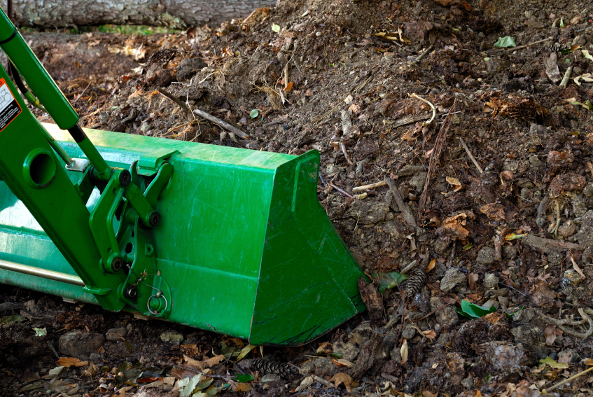 Turn larger compost piles with front-end loaders