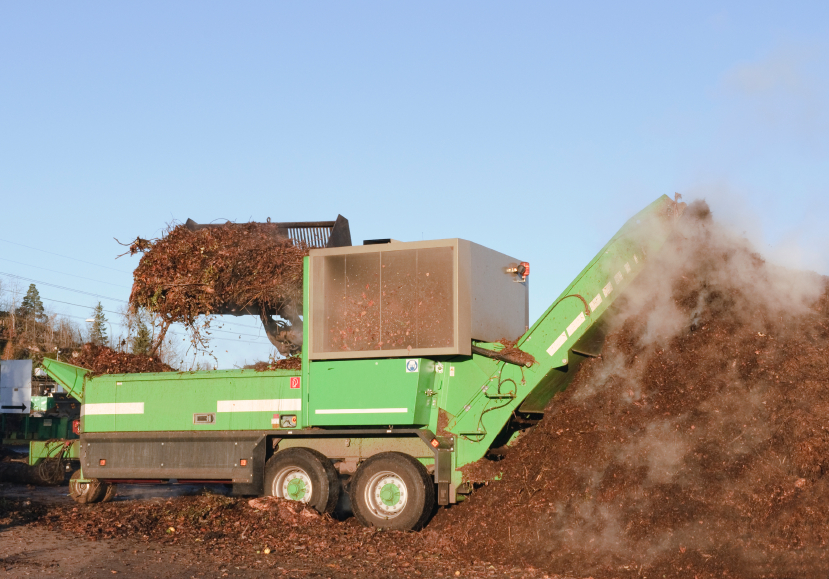 Mechanical grinders reduce particle size to aid decomposition of compostable materials